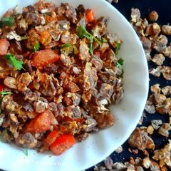 A picture of Chana Jor Garam Chaat / Black Chickpea Flakes Chaat.