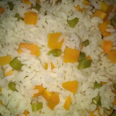 A picture of White rice with veggies.