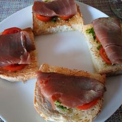 A picture of Bruschetta with salsa verde and smoked tuna.
