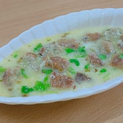 A picture of Farali Dumpling in buttermilk sauce.