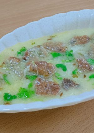 A picture of Farali Dumpling in buttermilk sauce.