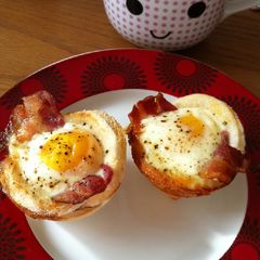 A picture of Baked egg and bacon tarts for breakfast.