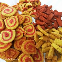A picture of Coconut's Colourful mathri and namakpare.