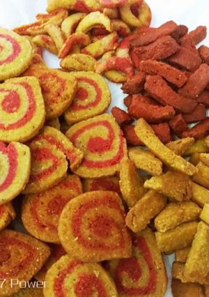 A picture of Coconut's Colourful mathri and namakpare.