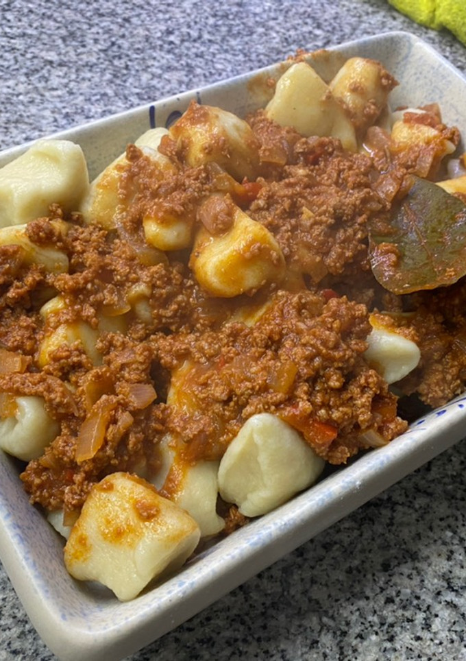 Una foto de Ñoquis de Papa y Harina con Bolognesa