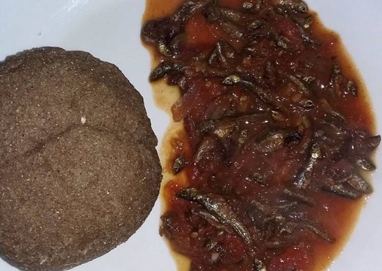 Stewed Omena served with brown ugali