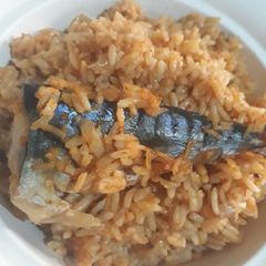 A picture of Jollof rice with fresh fish.