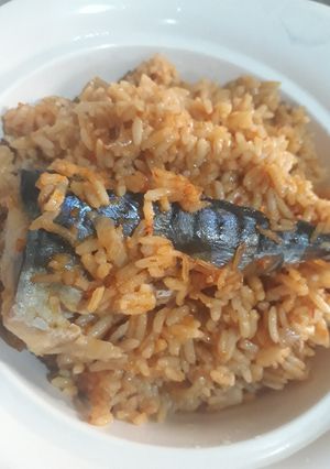 A picture of Jollof rice with fresh fish.