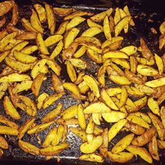 A picture of Baked rosemary potatoe wedges.