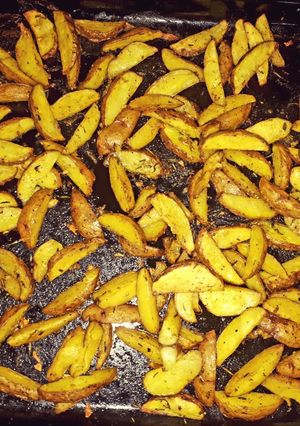 A picture of Baked rosemary potatoe wedges.