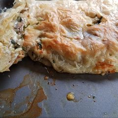 A picture of Three cheese, mushroom and onion roll.