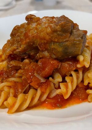 A picture of Fusilli with Pork Ribs in Tomato Sauce.