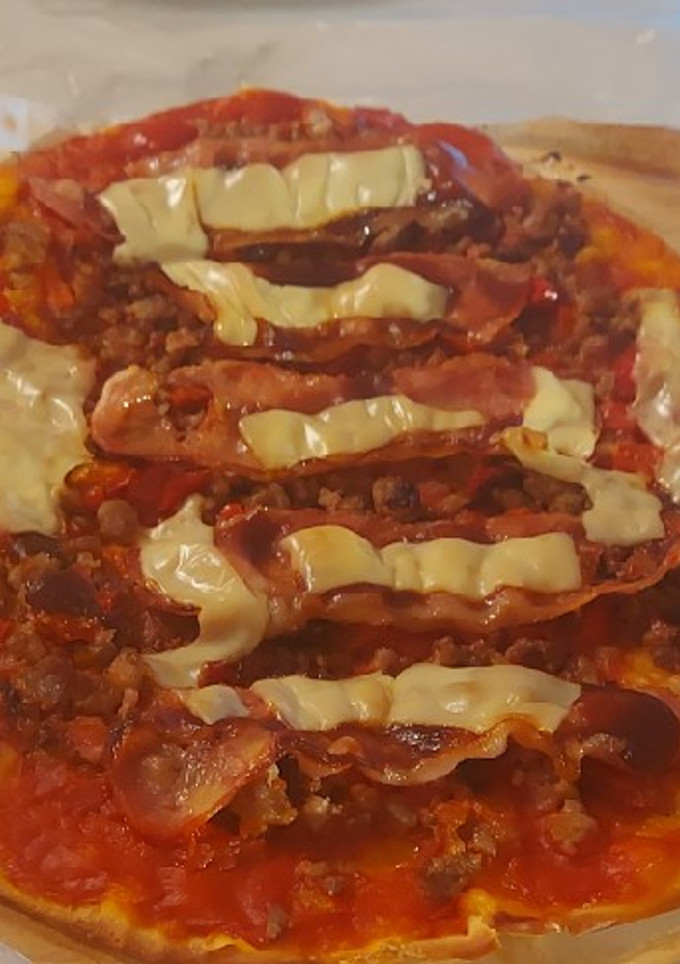 Una foto de Pizza a la barbacoa