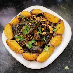 A picture of Karela and Potato Masala Fry.
