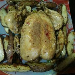 A picture of Chicken Steam Roast with Potato Wedges.