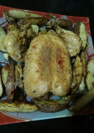 A picture of Chicken Steam Roast with Potato Wedges.