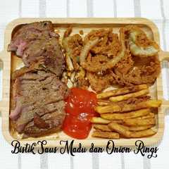 A picture of 187. Bistik Sapi dengan Saus Madu dan Onion Rings.