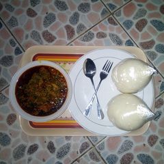 A picture of PoundedYam with Egusi Soup.