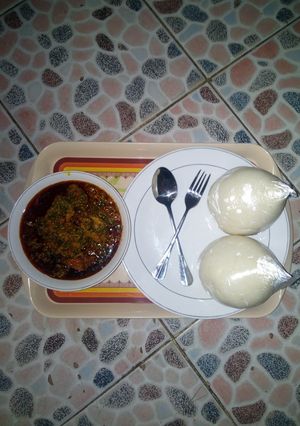 A picture of PoundedYam with Egusi Soup.