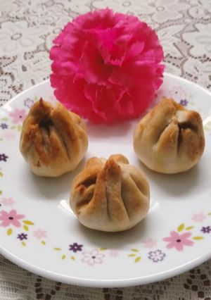 A picture of Baked Modak filled with fresh coconut, jaggery, poppy seeds and nutmeg (made in Air fryer).
