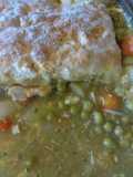 Chicken pot pie topped with biscuits