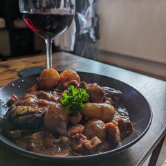 A picture of Coq Au Vin With Baby Potatoes.