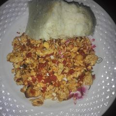 Fried eggs served with ugali A picture of Fried eggs served with ugali.