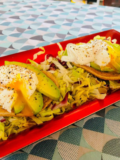 A picture of Poached Eggs with Avocado and Mixed Salad.
