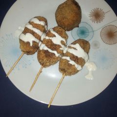 A picture of Meatballs on stick.