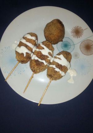 A picture of Meatballs on stick.