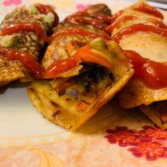 A picture of Oats chilla/utappam rolls.