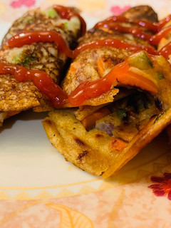 A picture of Oats chilla/utappam rolls.