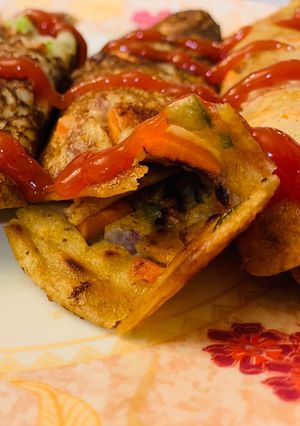 A picture of Oats chilla/utappam rolls.