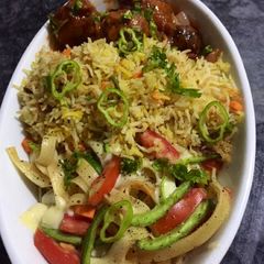 Egg fried rice with vegetables manchurian A picture of Egg fried rice with vegetables manchurian.