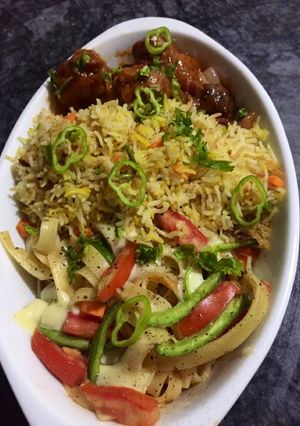 A picture of Egg fried rice with vegetables manchurian.