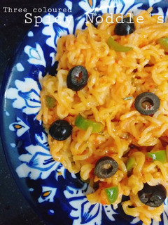 A picture of Three coloured spicy Noodles.