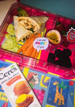 A picture of Sweet chilli chicken wrap and heart shaped cucumbers#mylunchboxideas.