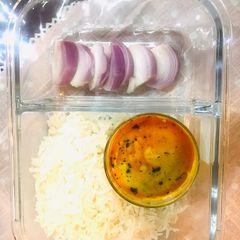 A picture of Punjabi kadi pakora with steamed rice.