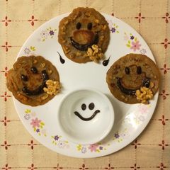 A picture of Banana pancakes Banana,Oats Pancakes and walnut topping.