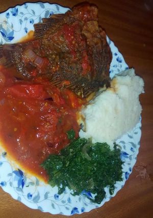 A picture of Fish stew and spinach.