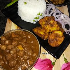 A picture of Chole With mutter chawal & jeera alu.