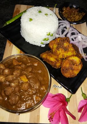 A picture of Chole With mutter chawal & jeera alu.