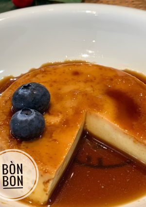 A picture of Baked Flan with Whipping Cream.