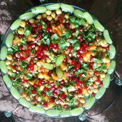 A picture of Chana chat with lots of fruits.