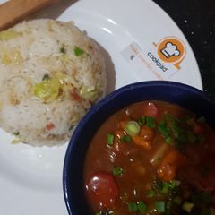 A picture of Chicken Shashlik with Vegetable Fried Rice.