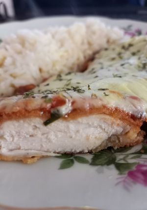 Una foto de Milanesas napolitanas de pollo 🐣