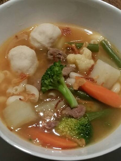 A picture of Beef Soup with Veggies and Fish Balls.