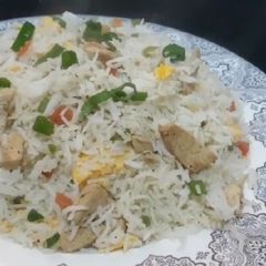 A picture of Chicken vegetable fried rice.