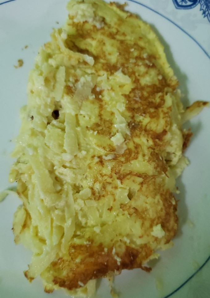 Una foto de Omelette de papa cruda y queso