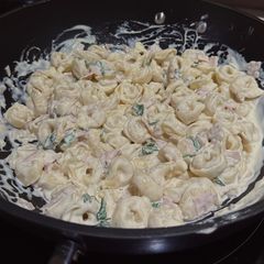 A picture of Cheesy, creamy tortellini.